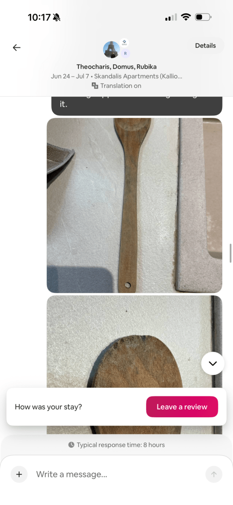 Close-up view of a wooden spoon on a flat surface, showcasing its texture and grain pattern.